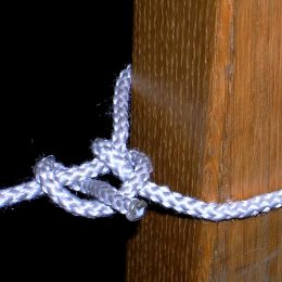 two half hitches knot tied around table leg