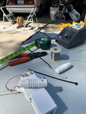 workbench with soldering iron & antenna parts