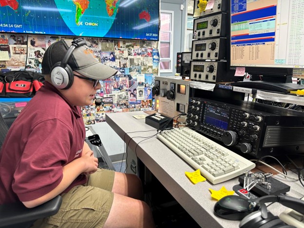 young ham radio operator at a desktop station