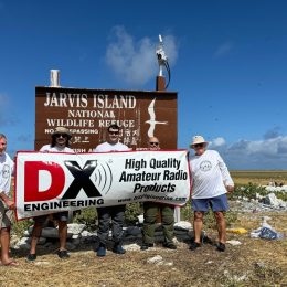 dxpedition team holding dx engineering banner at jarvis island