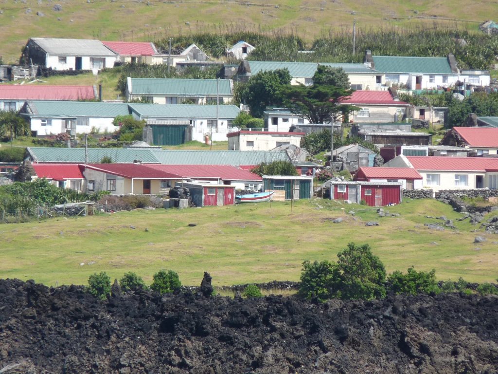 small seaside village photographed from the ocean