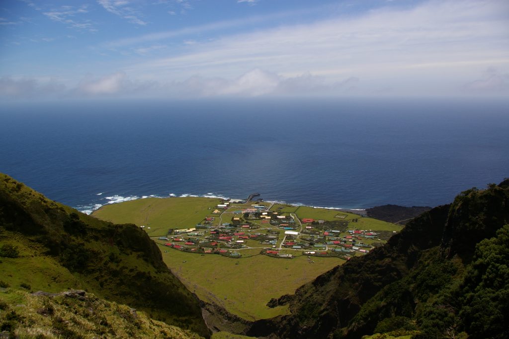 small seaside village photographed from a mountain top