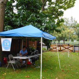 ham radio operator at a station under a tent