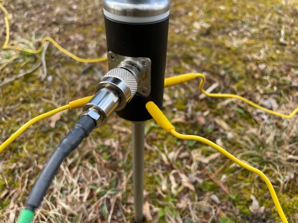 radial wires and RF connector on a portable antenna