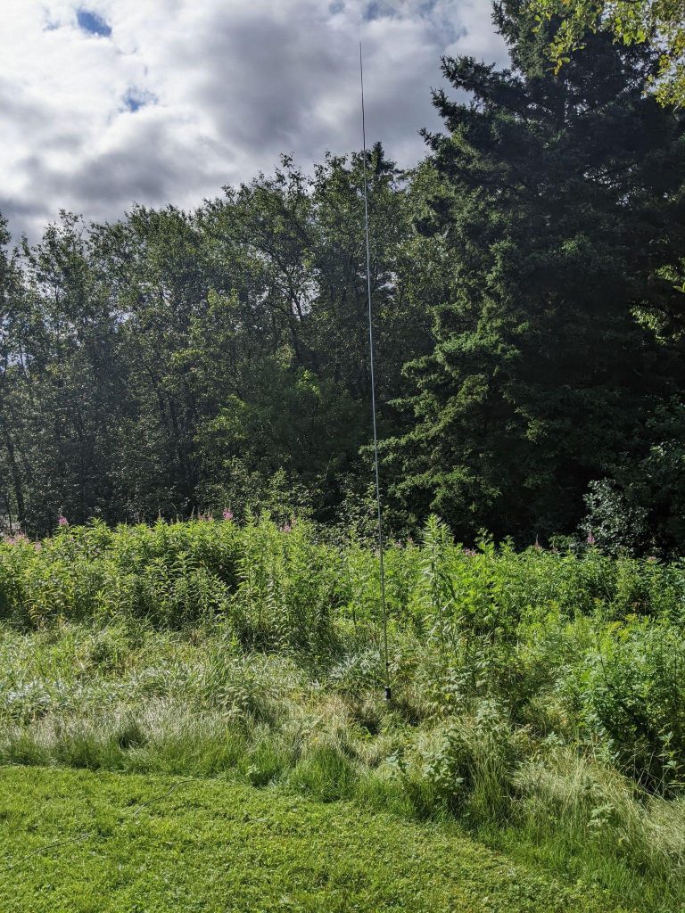 portable ham radio antenna set up in a field