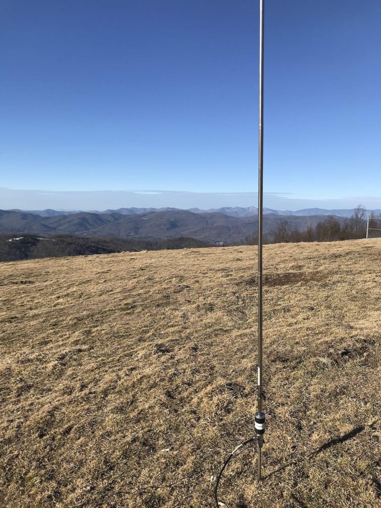 portable ham radio antenna set up over mountain range