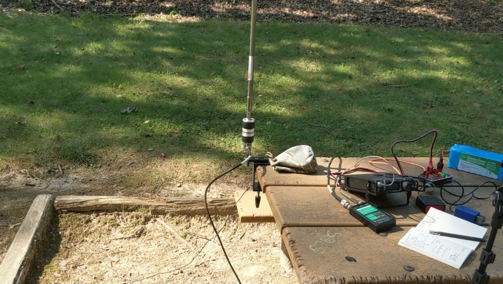 portable ham radio mounted to a picnic table