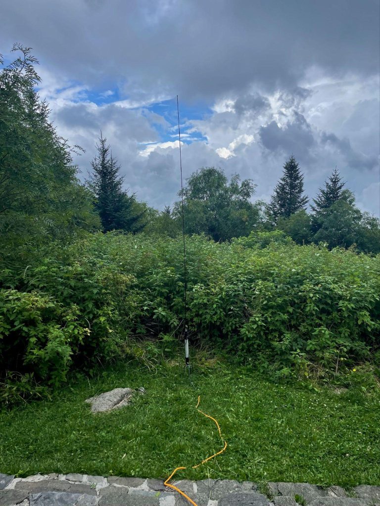 ham radio antenna installed near a forest