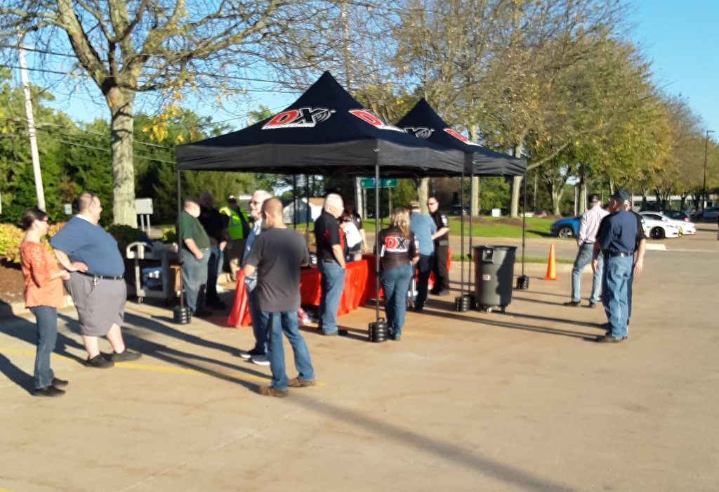 outdoor group mingling near DX Engineering tent