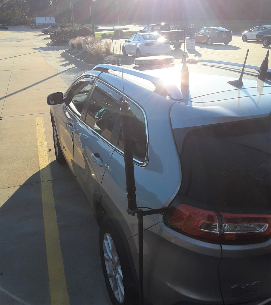 rear view of an SUV with several ham radio antennas installed