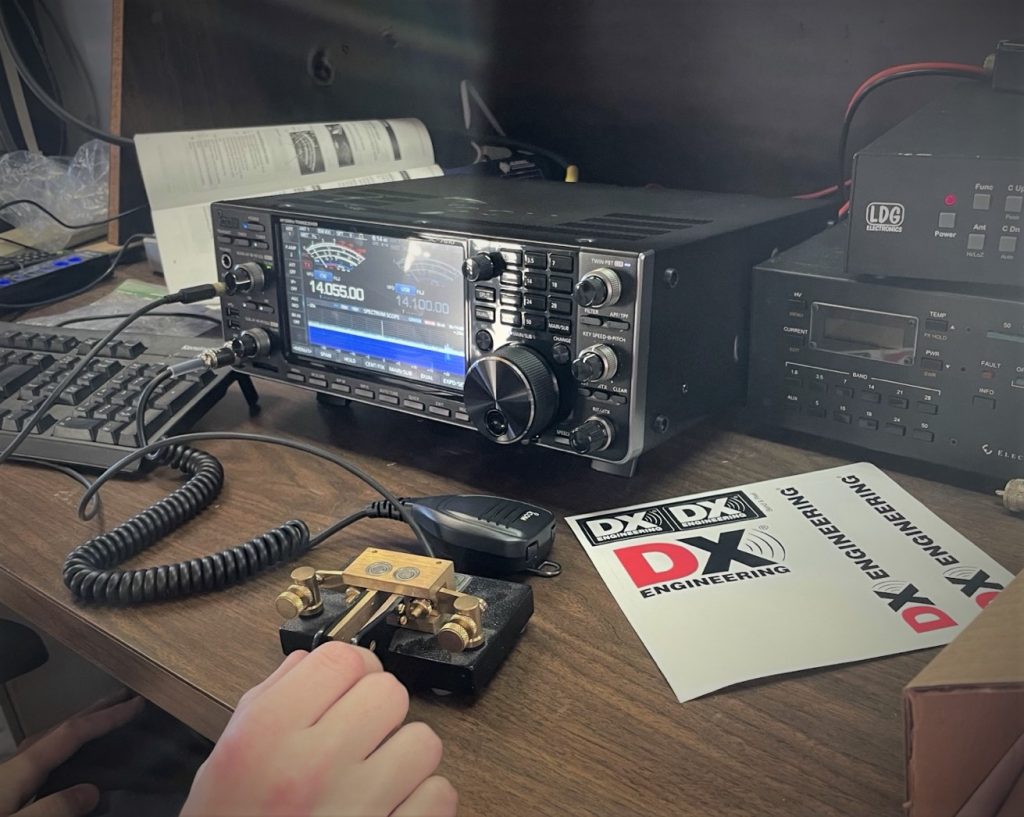 ham radio base station operating with CW paddles