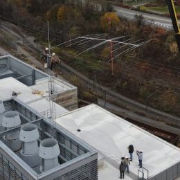 large yagi antenna being installed with a crane