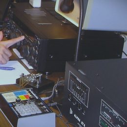 man working at a ham radio station