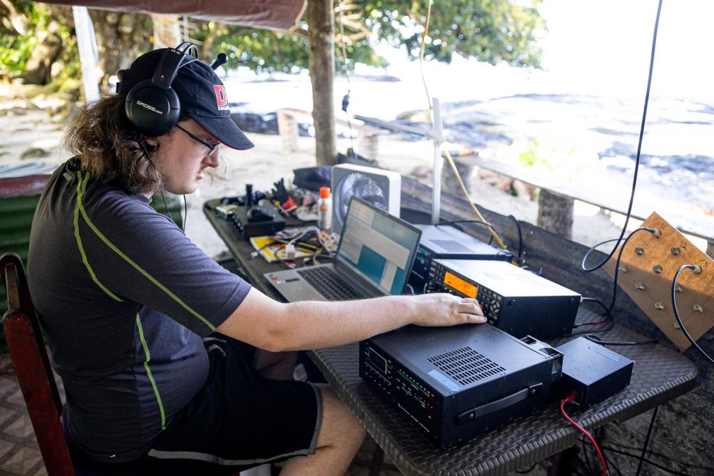 Man working at a remote ham radio station 