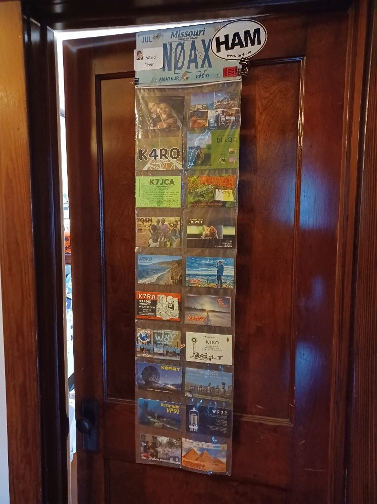 qsl card display rack on back of a door