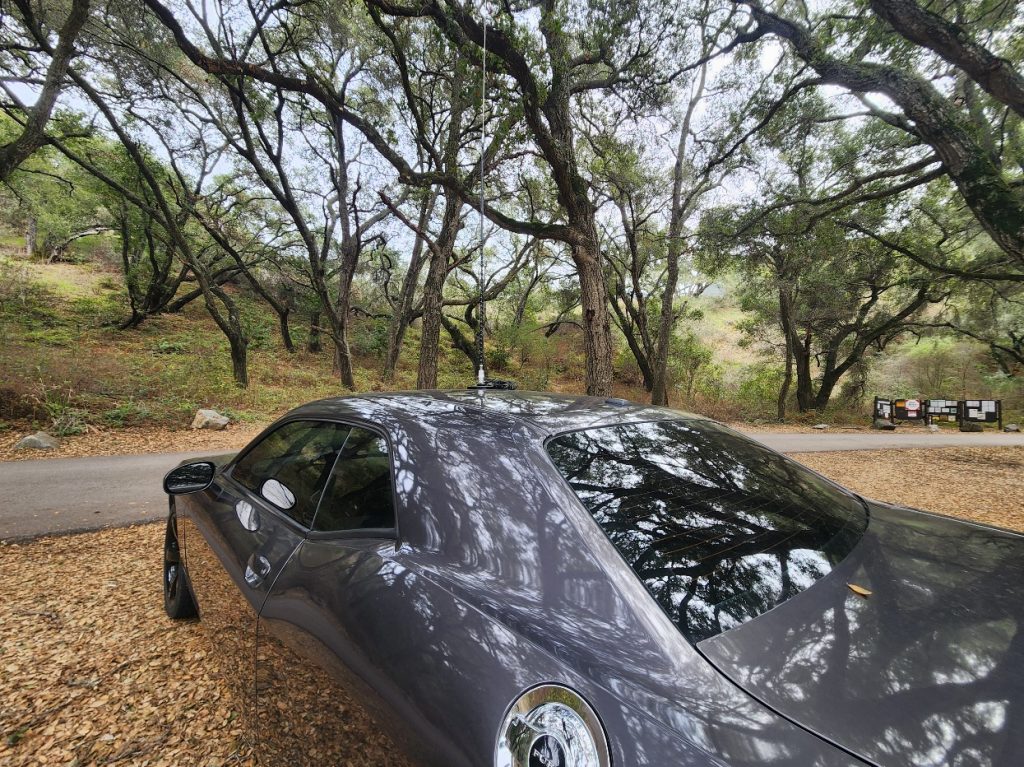 a car with a ham radio attached