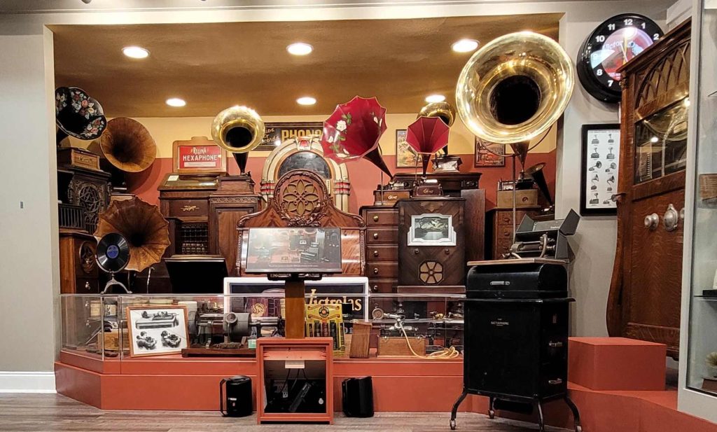 old radios and phonographs on display in museum