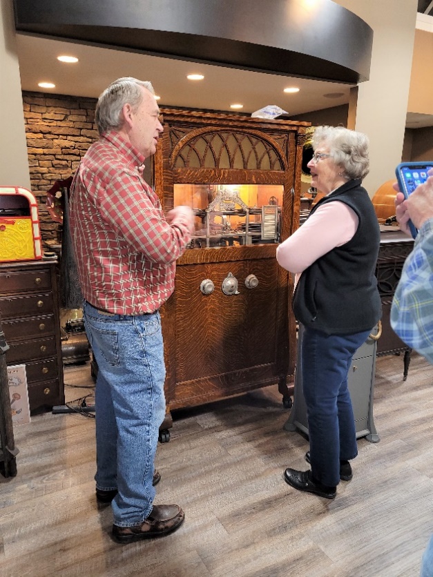 two people talking near antique radio