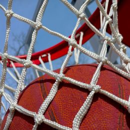 close up of basketball in a net